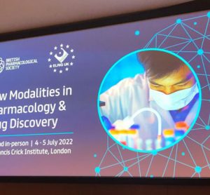 Image showing ELRIG and BPS event poster. Text: New modalities in pharmacology and drug discovery, Free and in-person 4 - 5 July at the Francis Crick Institue London. Image of a scientist and test tubes. Blue background