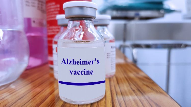 glass vial labelled 'Alzheimer's Vaccine'