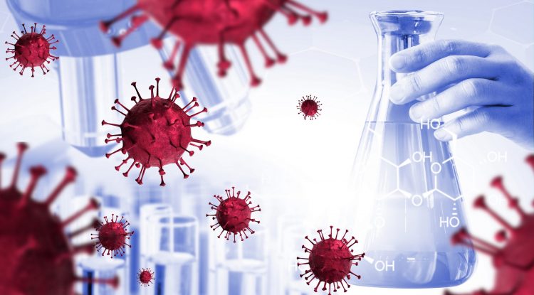 SARS-CoV-2 particles in red over a research background - microscope, connical flask and test tubes in grey