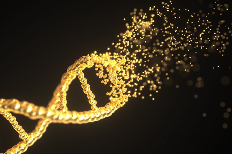 Golden DNA strand disintegrating on a black background