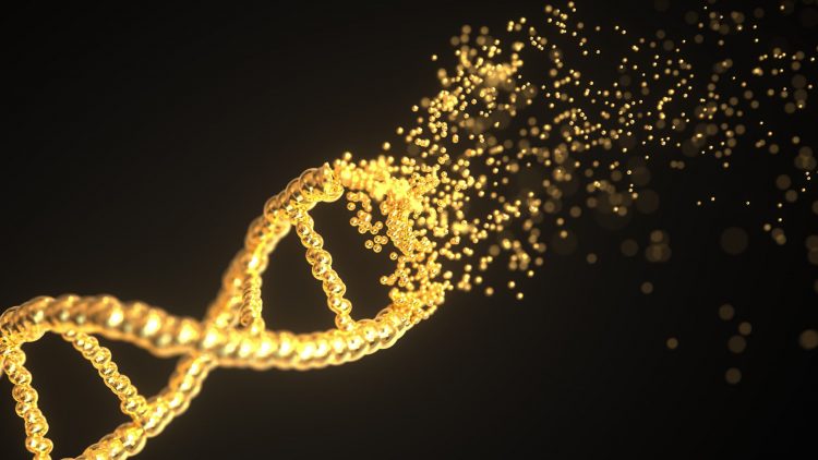 Golden DNA strand disintegrating on a black background