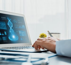 Doctor studying genetic disease in DNA research with laptop, analyzing genetic data