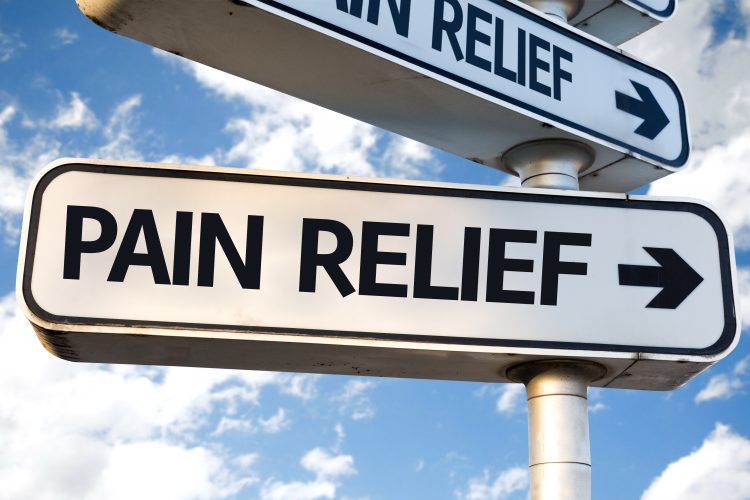 sign saying pain relief to the right