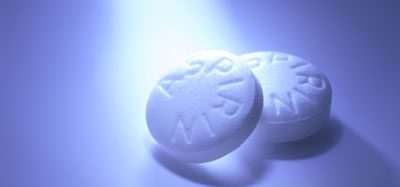 White Aspirin macro shot on aqua blue background