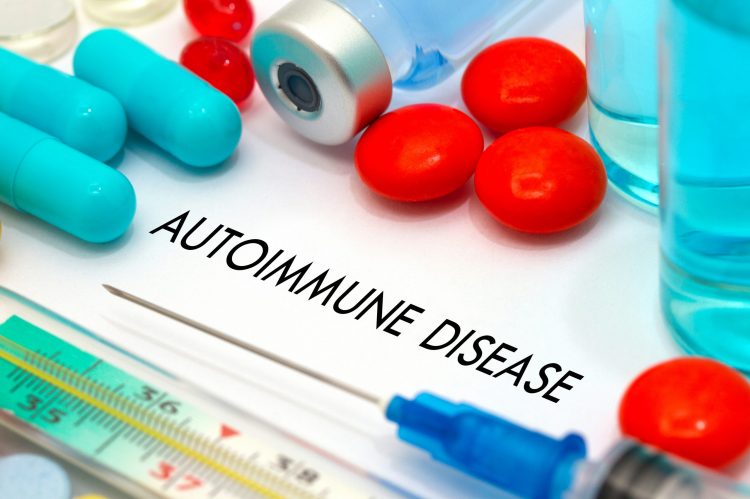 tablets, syringes and drug vials surrounding the words 'autoimmune disease'