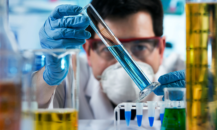 researcher holding test tube with chemist material in the investigation lab / chemical engineer working with tube test in the research laboratory