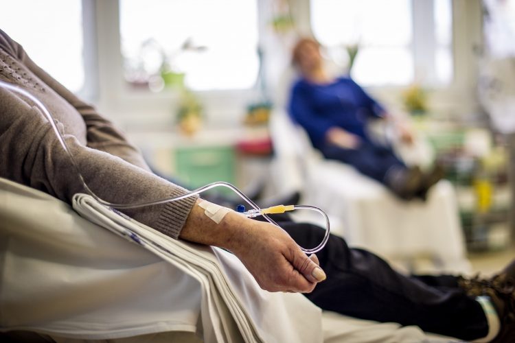 patient recieving chemotherapy through IV in a hospital ward