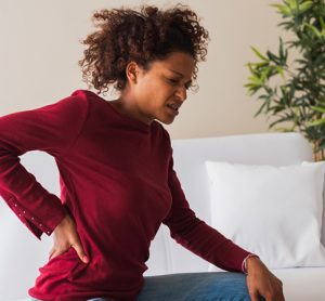 Person suffering chronic back pain