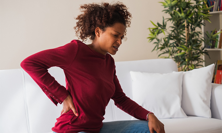 Person suffering chronic back pain