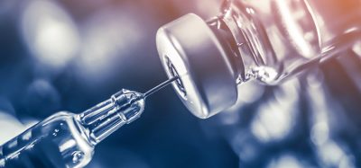 Vaccine vial dose flu shot drug needle syringe,medical concept vaccination hypodermic injection treatment disease care hospital prevention immunization illness disease baby child.blue background