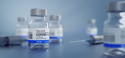 3D Illustration of a Generic Covid19 Vaccine and a Syringe, Blue Background