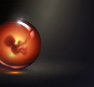 Human embryo in glass ball, pregnancy and obstetrics concept