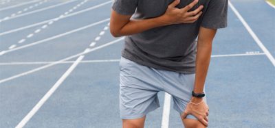 Sport man suffering from chest pain cardiac arrest after running.