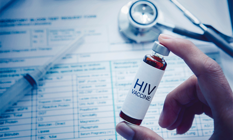 Close up of unknown doctor hand holding an ampule with HIV vaccine text