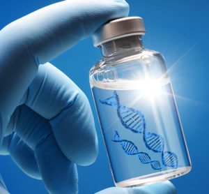 Doctor or scientist shows a vial of genetic agent as a vaccine or therapy against Corona or Covid-19 as a symbolic image