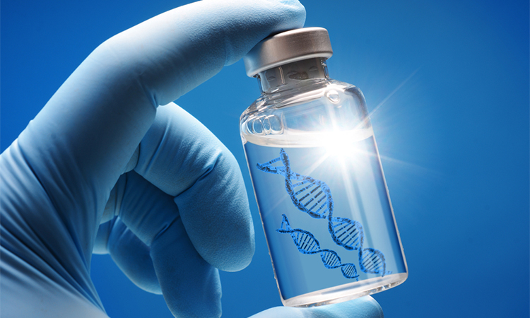 Doctor or scientist shows a vial of genetic agent as a vaccine or therapy against Corona or Covid-19 as a symbolic image