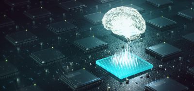 luminous brain hovering above computer motherboard