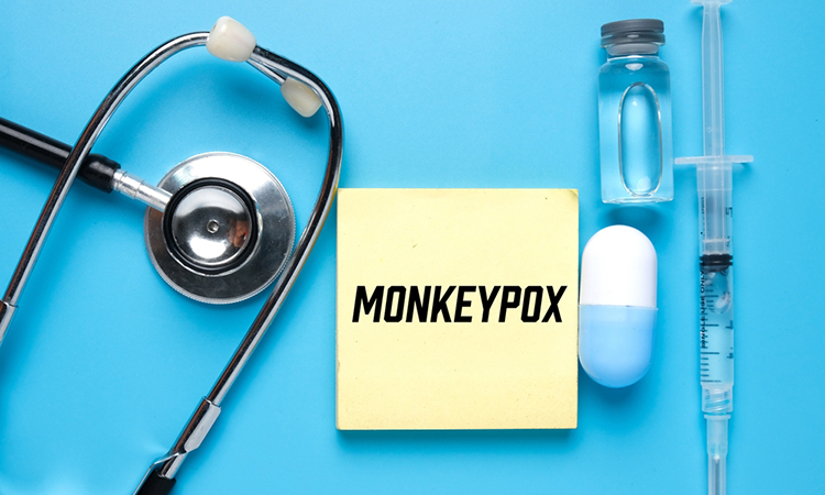 A picture of notepad written monkeypox, stethoscope ,medicine and vaccine. Monkeypox is virus transmitted to humans from animals with symptoms very similar to smallpox.