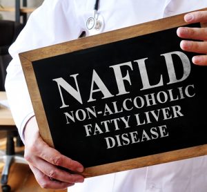 Non-alcoholic fatty liver disease NAFLD the doctor is holding a sign.
