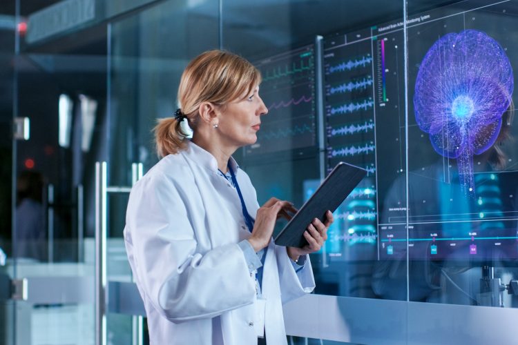 woman looking at a brain scan