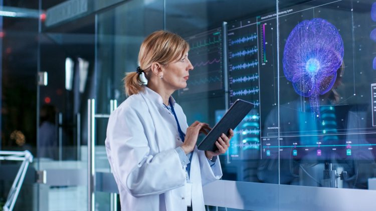 woman looking at a brain scan