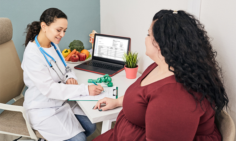 Obesity, unhealthy weight. Nutritionist calculating body mass index of fat woman for obesity treatment