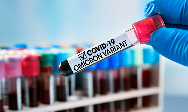 Researcher in analysis lab holding sample of new strain of Coronavirus Mutations Omicron. Doctor with blood sample of New Variant of Covid-19 called Omicron B.1.1.529