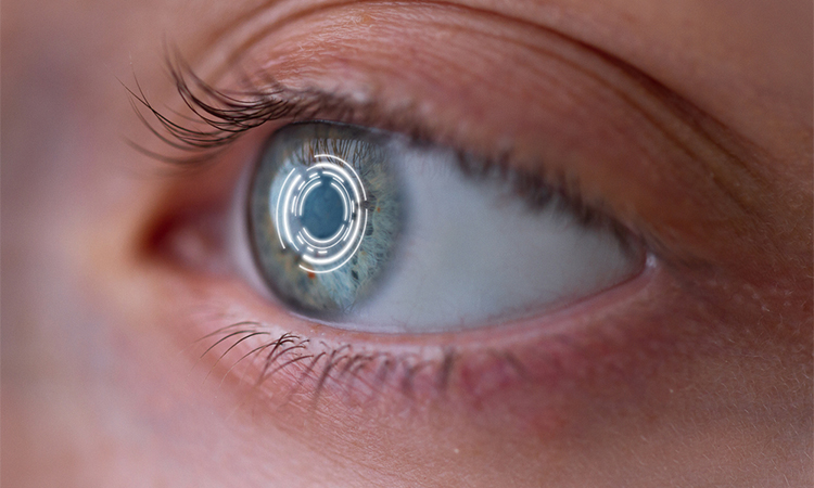 Woman's eye with smart contact lens with digital and biometric implants to scan the ocular retina close up. Concept of future and technology for digital scans