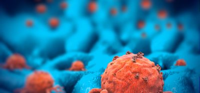 Orange cancer cells on blue background