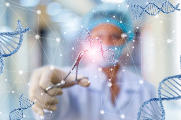 Woman cutting DNA molecules, indicating CRISPR