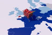 Shopping cart filled with red capsules placed on a map of Europe and the UK, symbolizing access and regulation of medicines.