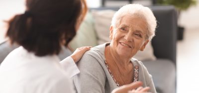 Older woman talking to doctor