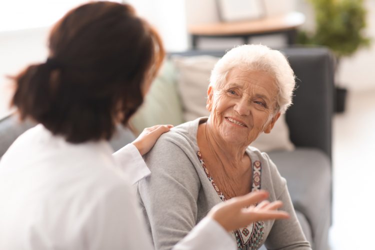 Older woman talking to doctor