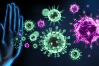 Digital illustration of a human hand blocking floating virus particles, symbolizing the immune system defending against viral infections.