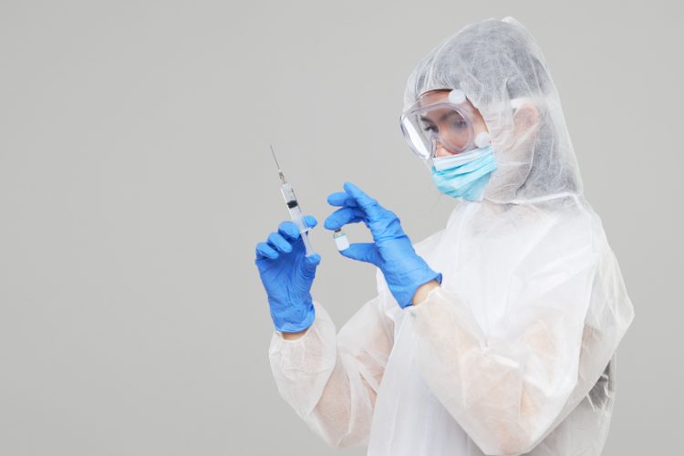 Scientist holding COVID-19 vaccine