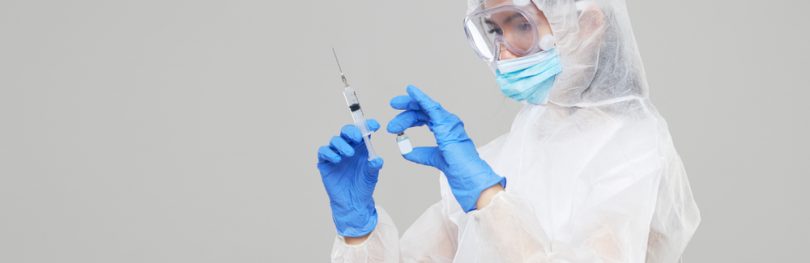 Scientist holding COVID-19 vaccine