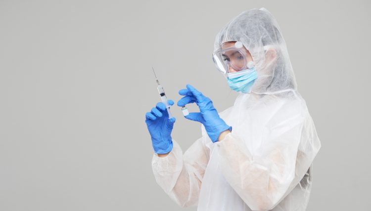 Scientist holding COVID-19 vaccine