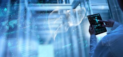 Digital wireframe liver visualised with data networks and interface graphics, representing AI driven analysis of drug induced liver injury in early drug discovery