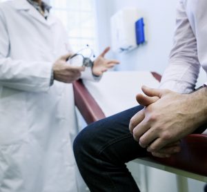 Man receiving consultation to doctor