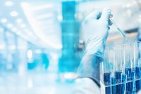 Scientist pipetting samples into test tubes in a modern laboratory, representing next-generation lab technologies and the Lab of the Future.