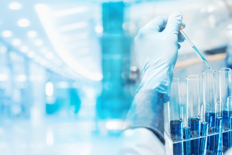 Scientist pipetting samples into test tubes in a modern laboratory, representing next-generation lab technologies and the Lab of the Future.