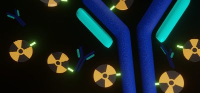 3D illustration of a Y-shaped antibody-like molecule interacting with radioactive isotopes, representing targeted radioligand therapy using engineered proteins such as DARPins.
