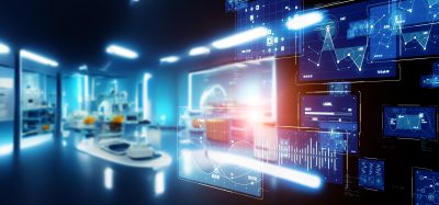 Futuristic automated laboratory interior with digital data dashboards, analytics visualisations and AI-driven interfaces overlaying a modern life sciences research environment.