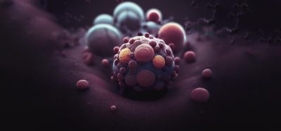 3D illustration of nanoparticles interacting with a cancer cell surface, representing advanced nanomedicine and targeted drug delivery