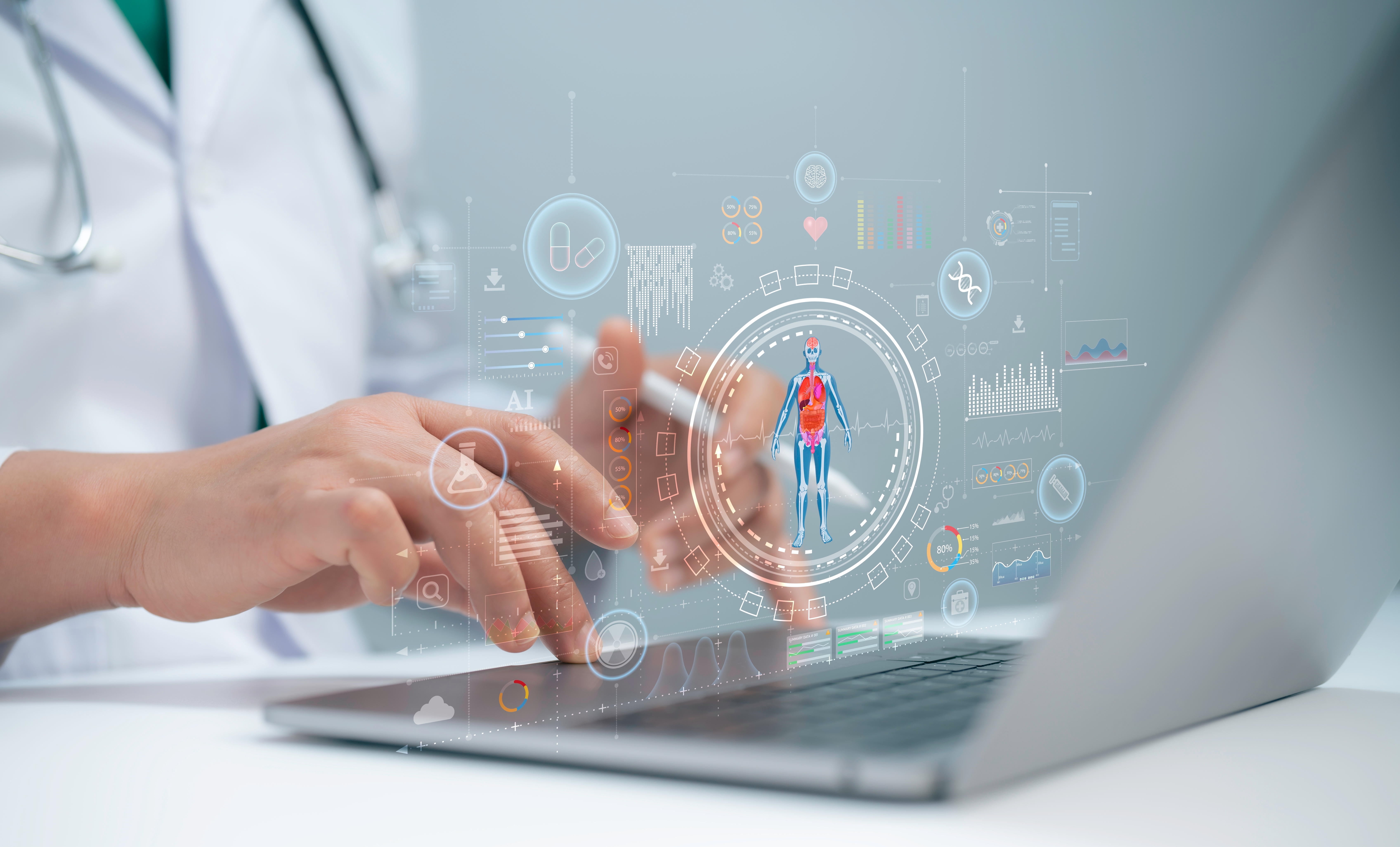 A medical researcher using a laptop with digital graphics of human anatomy, molecular data, and AI analytics overlays, symbolising the integration of artificial intelligence and biological data in drug discovery.