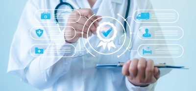 Doctor interacting with a digital healthcare compliance and clinical trial approval interface.