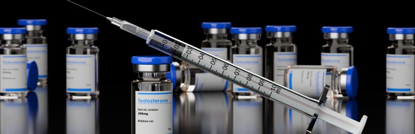 Numerous testosterone steroid vials with syringe leaning on the one in front on black background, anabolic steroid for muscle growth , selective focus, 3D illustration