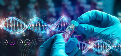 Gloved hands holding a vial with a DNA helix overlay