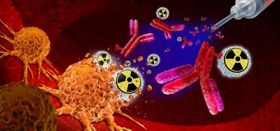 Illustration of radiopharmaceuticals targeting and destroying cancer cells using radioactive isotopes and antibodies.