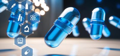 Blue capsules floating with scientific icons representing drug discovery and biotechnology.